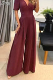 Women Jumpsuit Puff Short Sleeve V Neck Backless Nipped Waist Loose Wide Legs Casual Pants Romper High