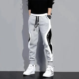 Men's plus size wide loose nine-point sports pants Korean version of the new casual sports student sports tie-foot men's